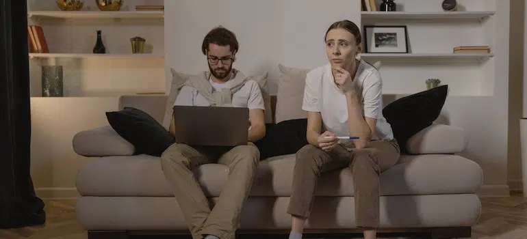 a couple sitting in a room and thinking