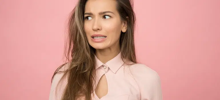 a young woman confused as she doesn't know how to spot lowball moving estimates