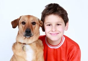 A kid with his dog 
