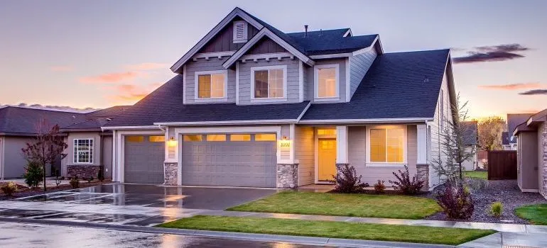 blue and gray concrete house with attic during twilight 186077 e1578792665447
