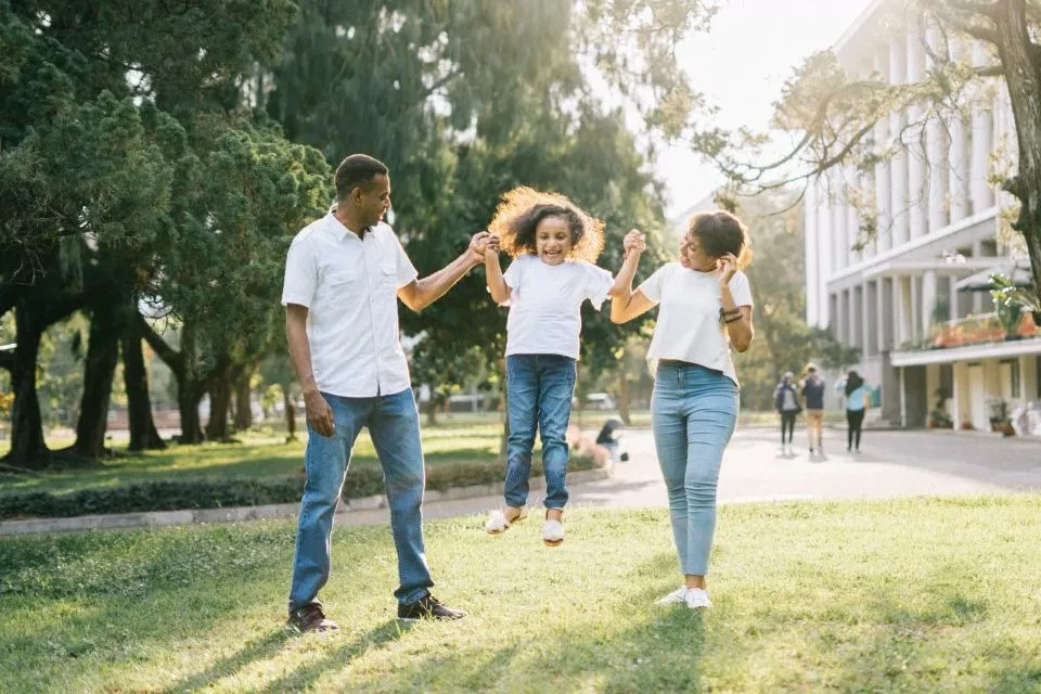 a man and a woman assisting a girl while jumping 1128317 scaled e1580594849607