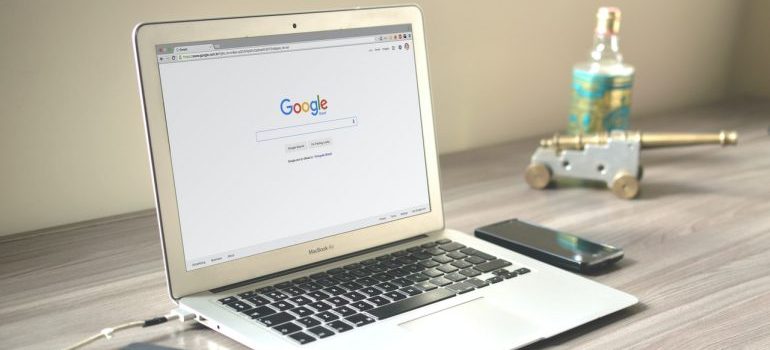 A laptop with the Google search engine on the screen